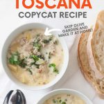 Overhead of two bowls of finished soup with slices of bread and spoons beside them. A text overlay reads, "Zuppa Toscana Copycat Recipe. Skip Olive Garden and Make It At Home!"