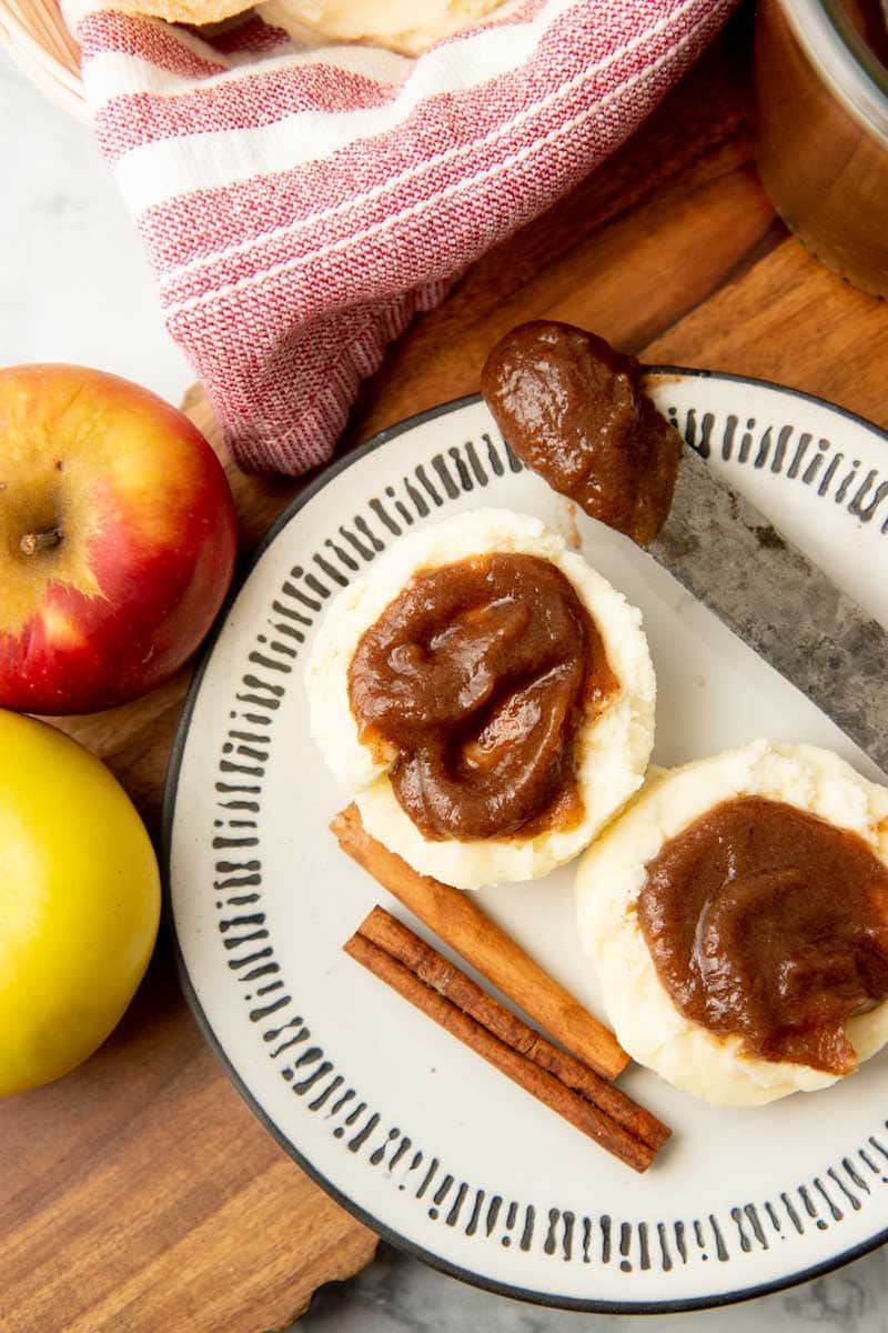 Spiced apple butter spread on two biscuits.
