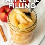 A spoon scoops apple pie filling from a Ball canning jar. A text overlay reads, "How to Can Apple Pie Filling from the Makers of Ball Home Canning Products."