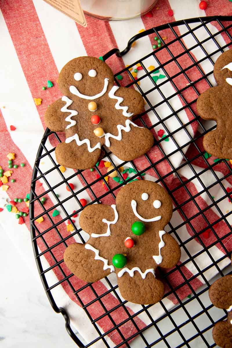 Overhead of decorated cookies on a cooling rack.