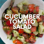 Cucumber tomato salad in a white bowl on a teal backdrop. A text overlay names the dish