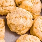 Tight view of tender, fluffy drop biscuits on a serving tray.