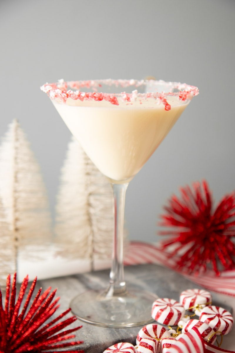 Crushed peppermint candies rim the glass of a peppermint martini.