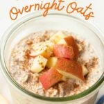 A jar of apple cinnamon overnight oats topped with chopped apples and cinnamon. A text overlay reads, "Apple Cinnamon Overnight Oats."