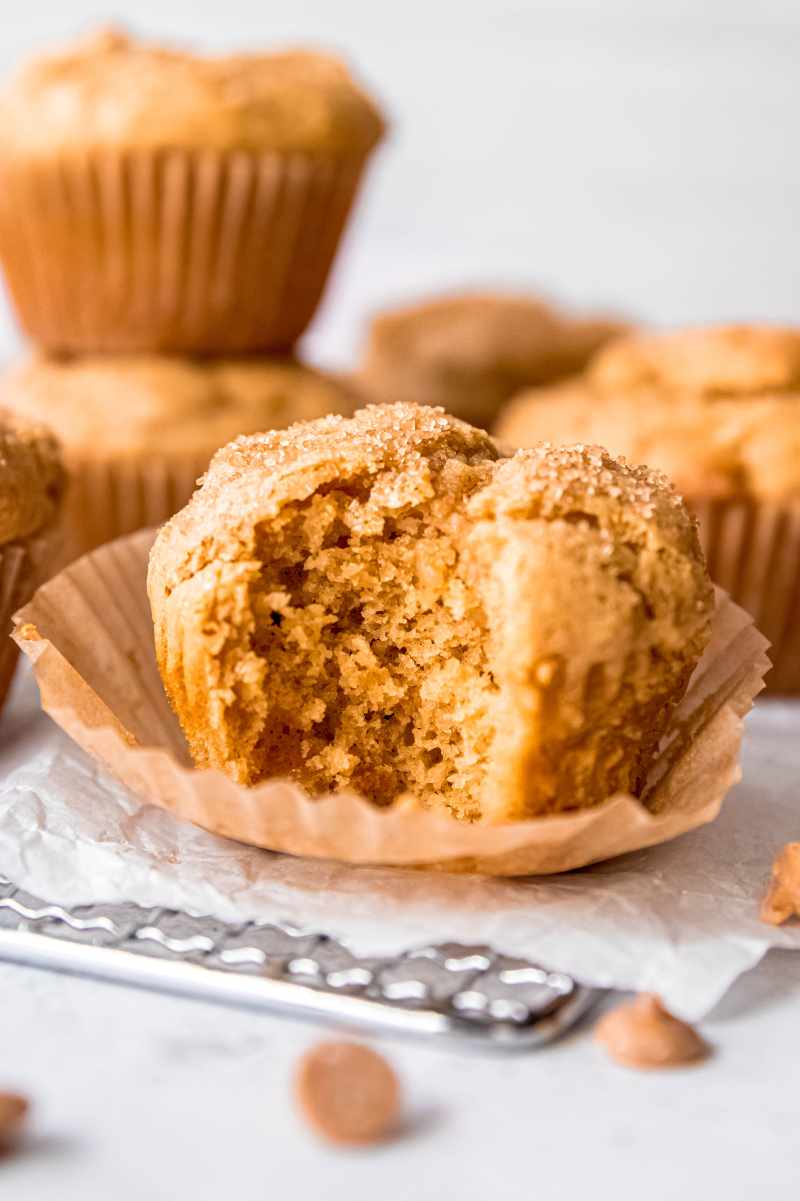 Close view of a tender muffin with a bite taken out of it showing the perfectly baked center.