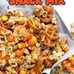 Halloween party mix on parchment paper, with a text overlay