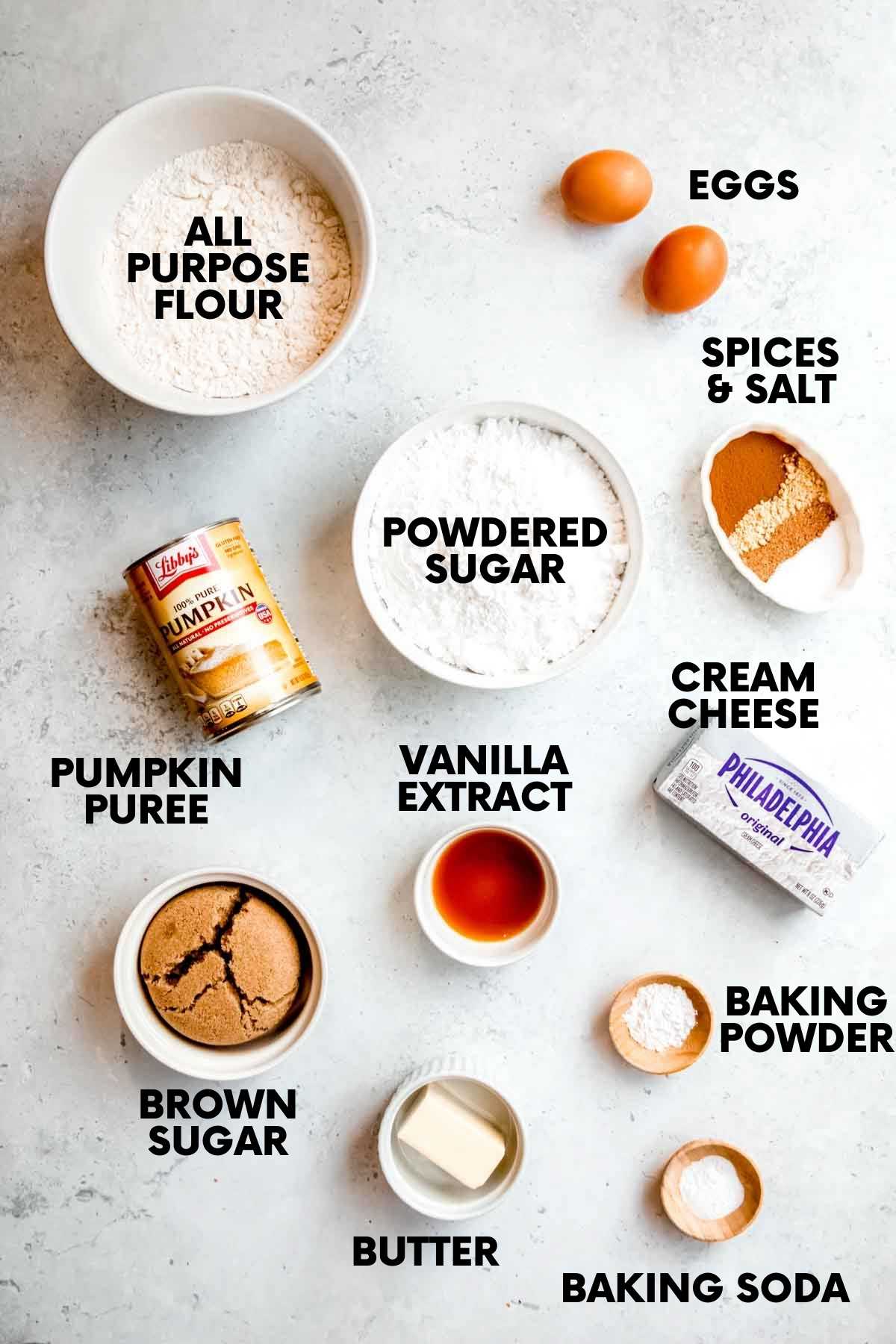 Ingredients for pumpkin cake including: flour, powdered sugar, eggs, pumpkin, cream cheese, brown sugar, butter