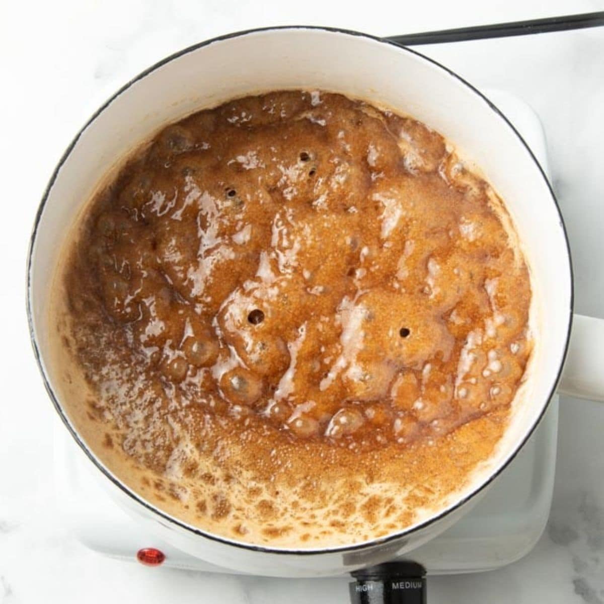 Caramel for caramel corn boiling in pot