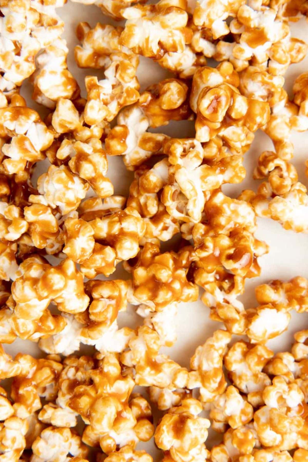 Caramel popcorn on a white baking sheet