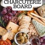 A cheese board on a black slate platter