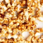 Caramel popcorn on a white baking sheet