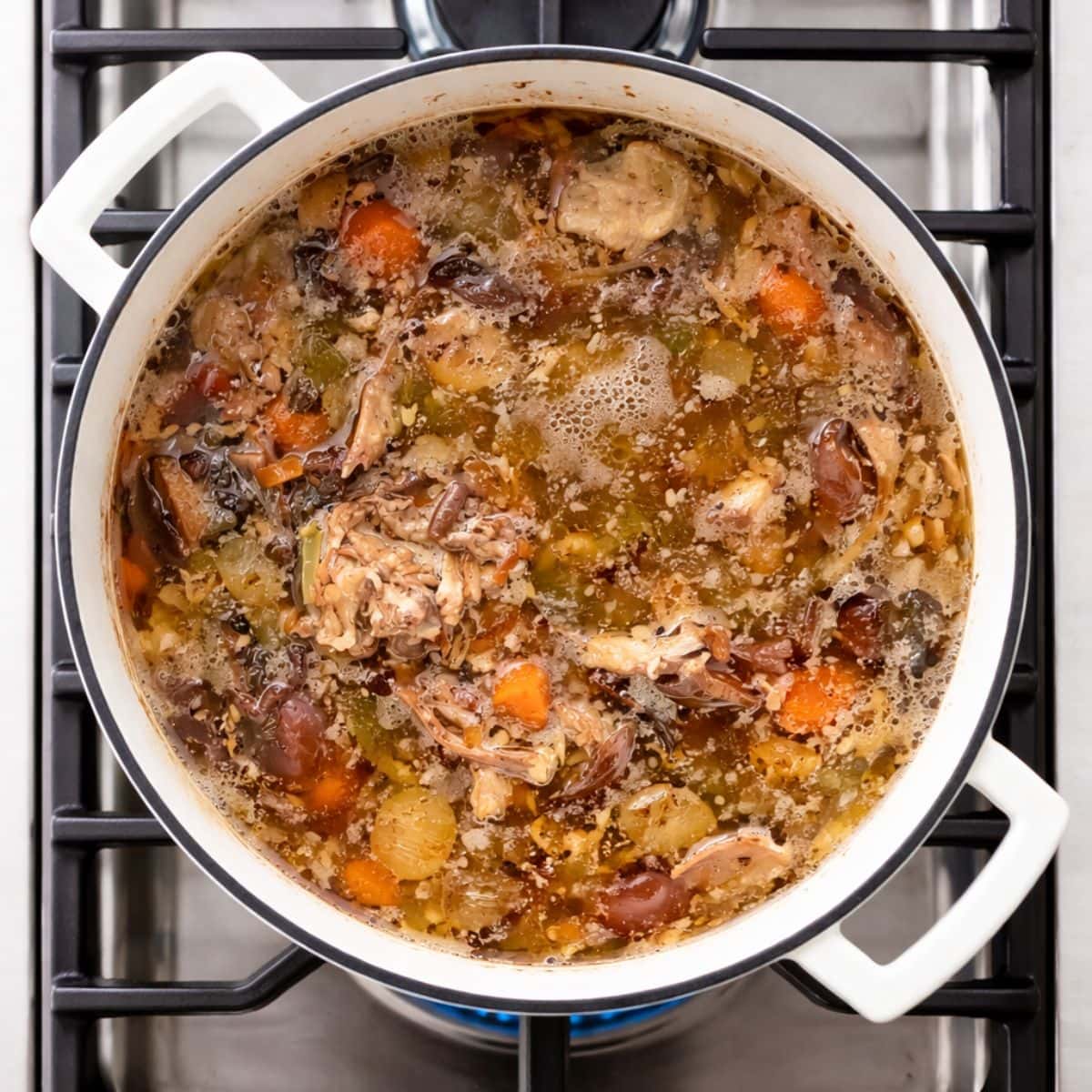 Bone broth simmering on stove