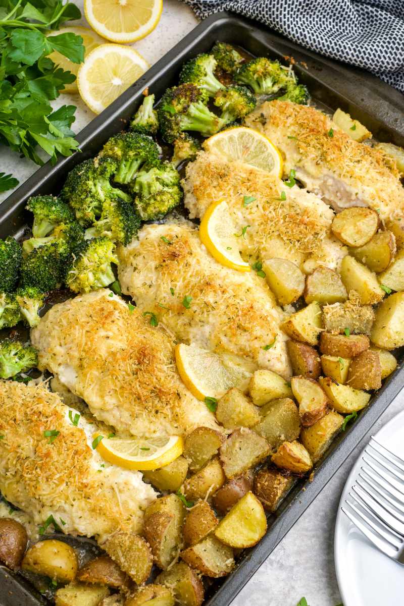One pan lemon chicken tray bake with potatoes, broccoli, and parmesan.