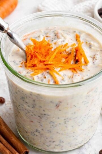 Jar of carrot cake overnight oats on a countertop