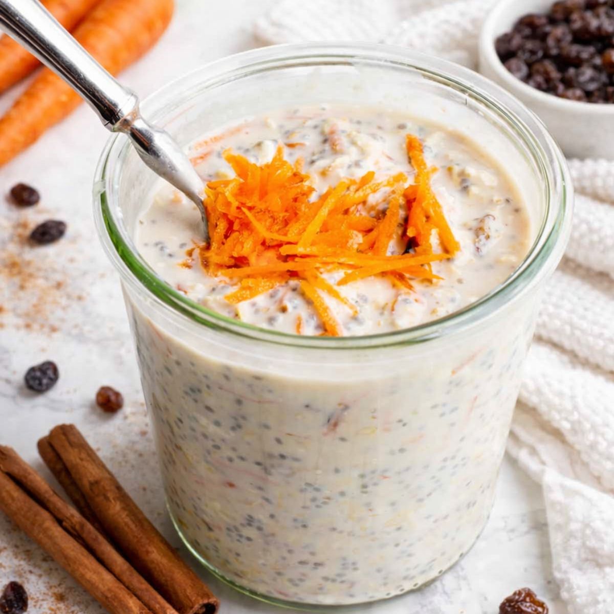 Jar of carrot cake overnight oats on a countertop
