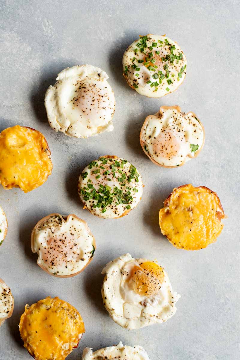 Top view of breakfast egg bites on a light counter.