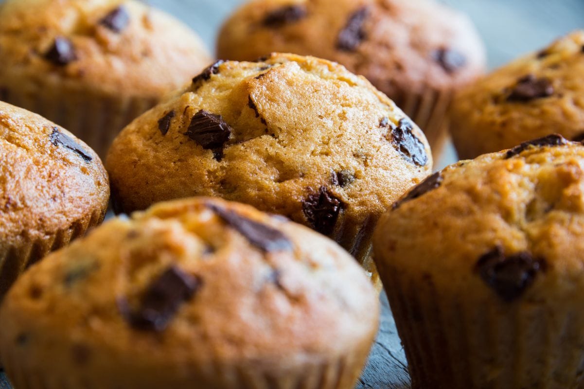 Close view of bakery style domed muffin tops.