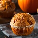 Close view of the crunchy sugar top on a perfectly domed bakery-style muffin.