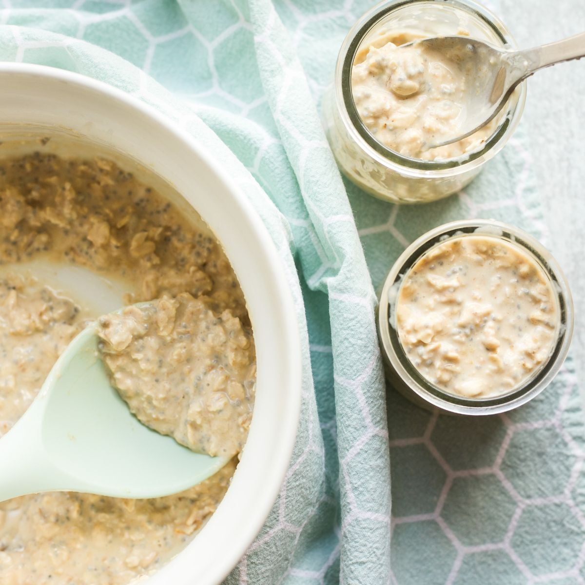 Spooning overnight oats into jars