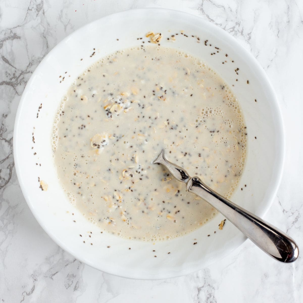 Stirring up overnight oats in mixing bowl
