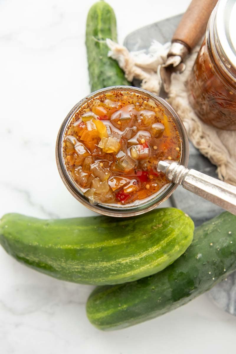 Top view of an open jar of homemade sweet pickle relish.