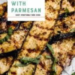 Grilled parmesan zucchini slices piled on parchment paper garnished with ribbons of fresh basil. A text overlay reads, "Make it Tonight! Grilled Zucchini with Parmesan. Easy Vegetable Side Dish."
