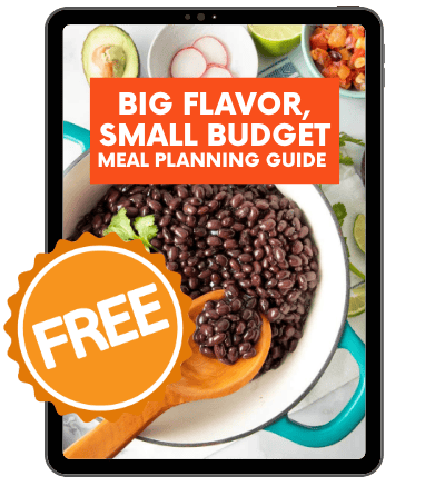 Black beans in a teal Dutch oven with a wooden spoon stirring them. Text overlay reads "Big Flavor, Small Budget Meal Planning Guide"