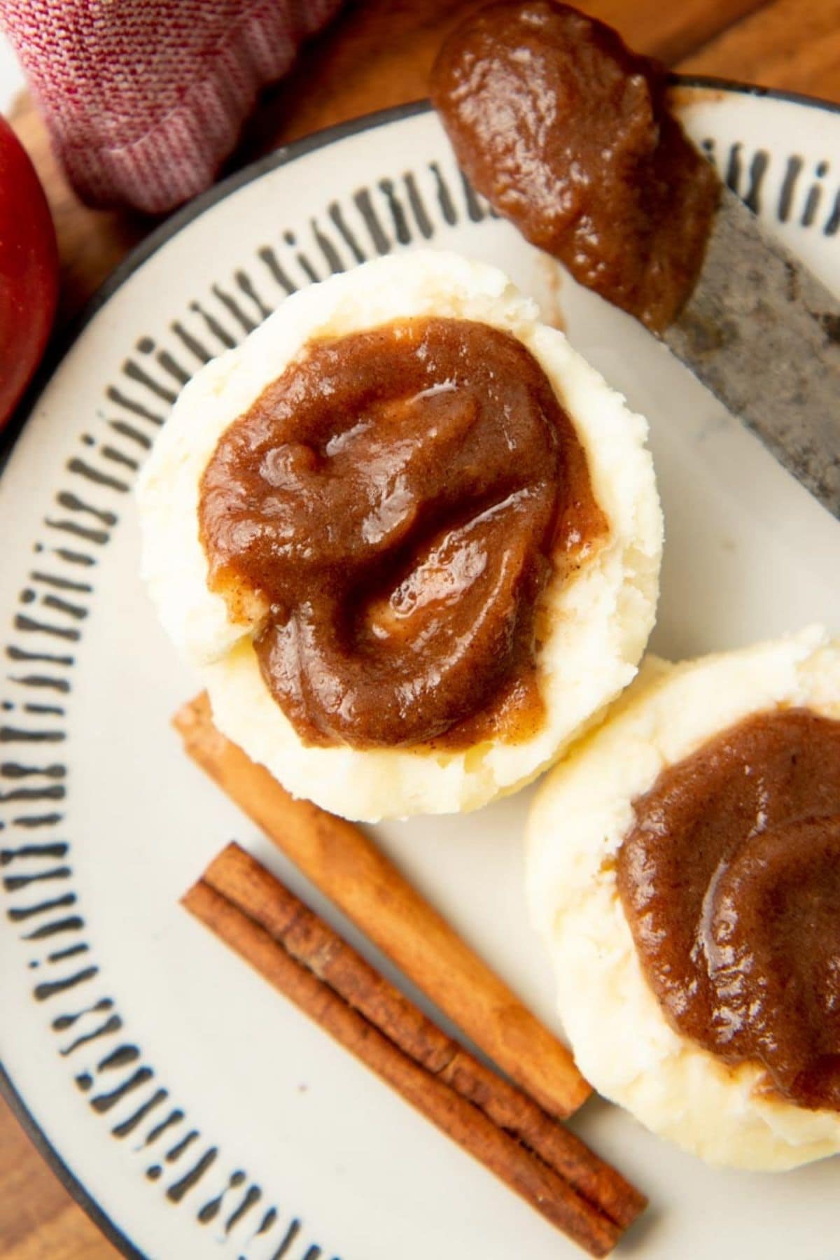 Instant pot apple butter spread on a split biscuit