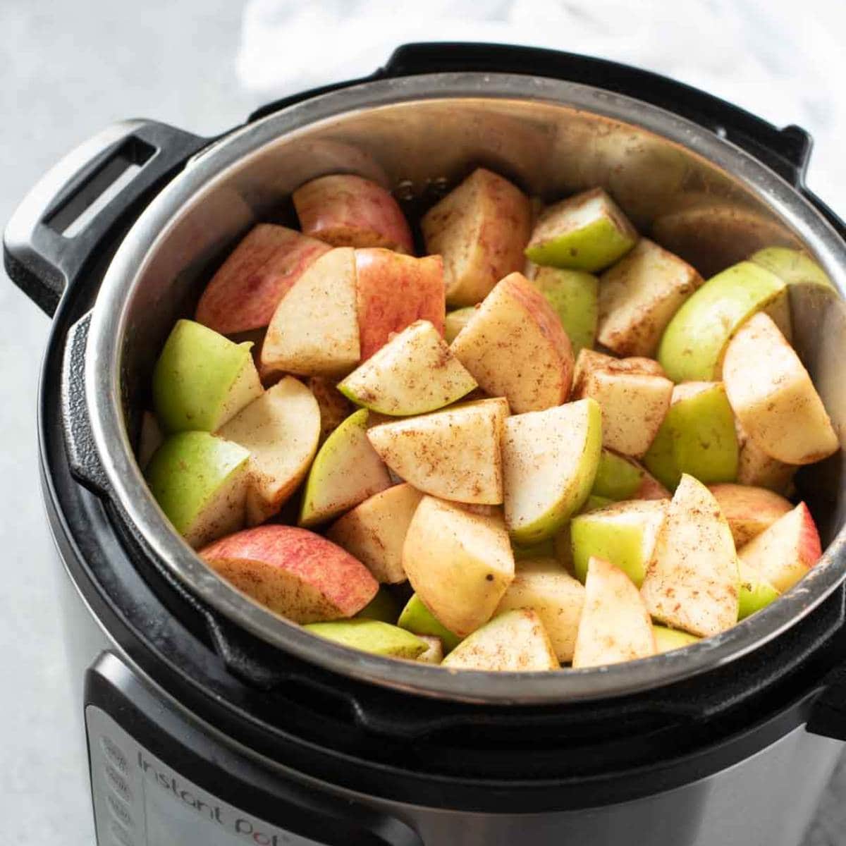 Apples sprinkled with cinnamon in an Instant Pot