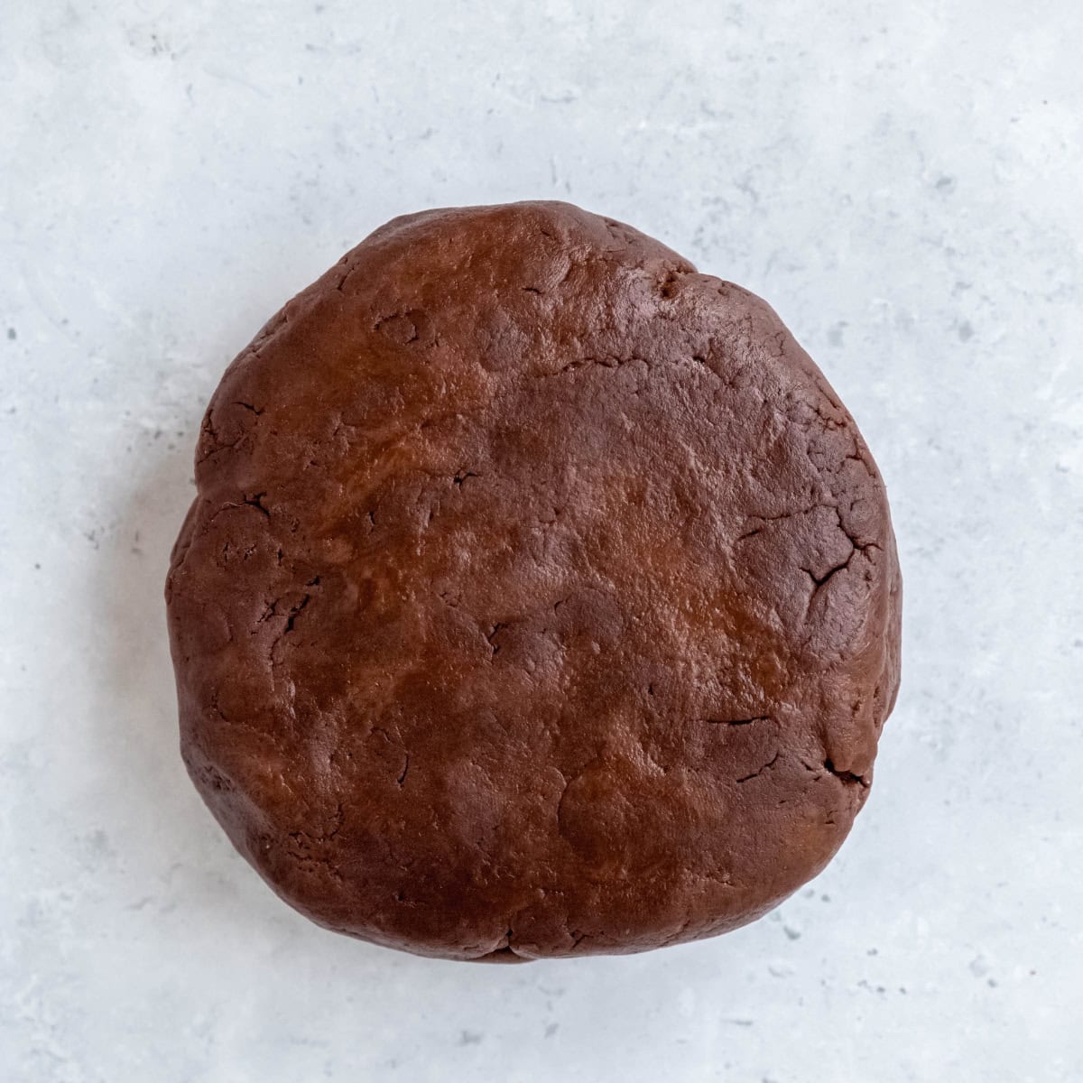 A disc of chocolate pie dough.