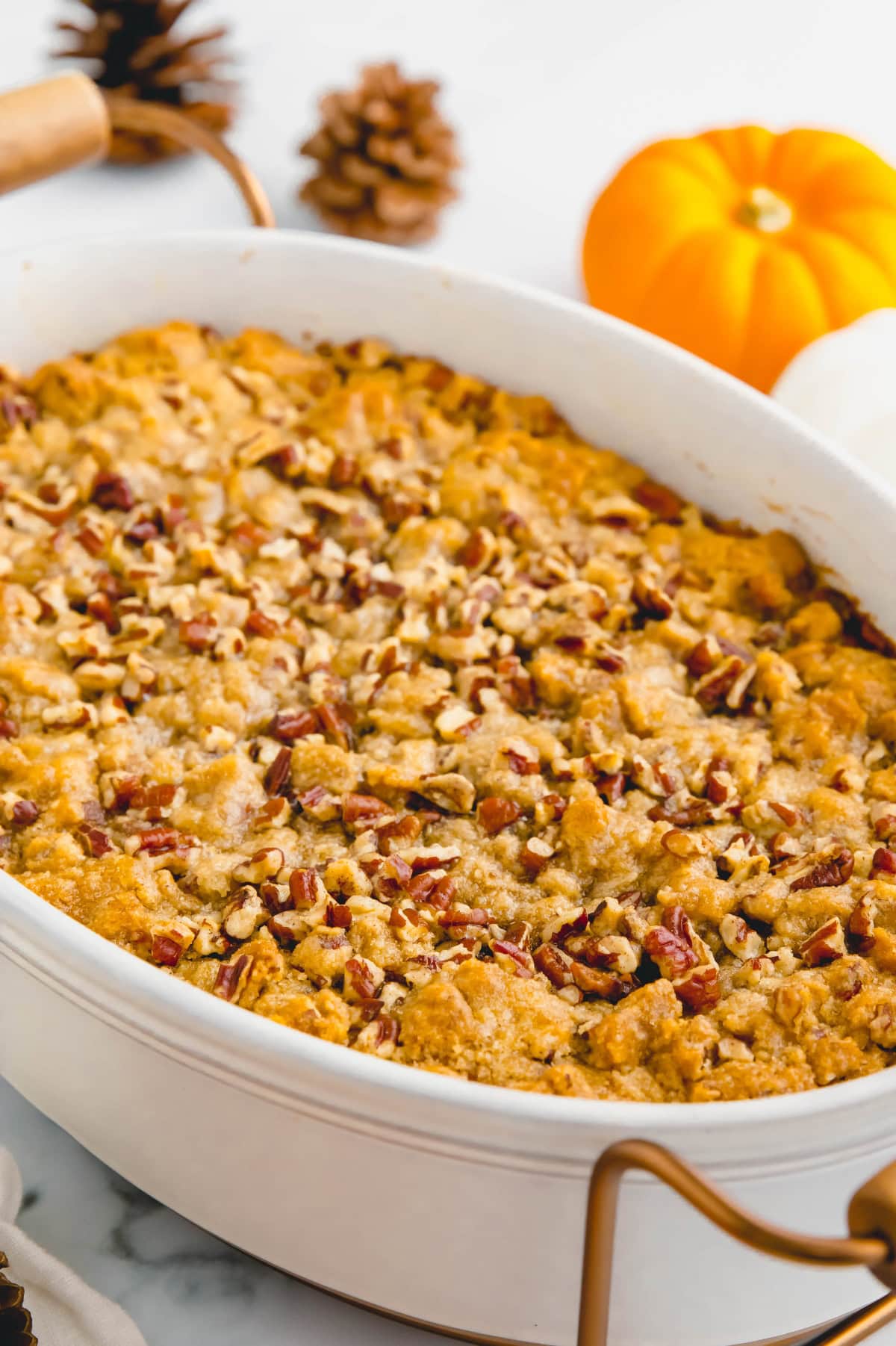 Baked sweet potato casserole with pecans.