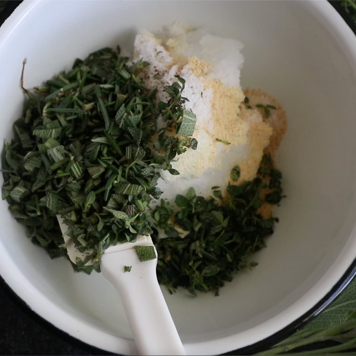 Herbs and coconut oil, ready for seasoning a turkey breast.