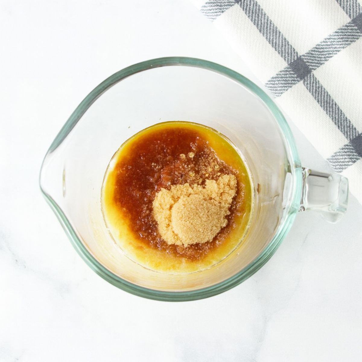 Melted butter with brown sugar in a big bowl