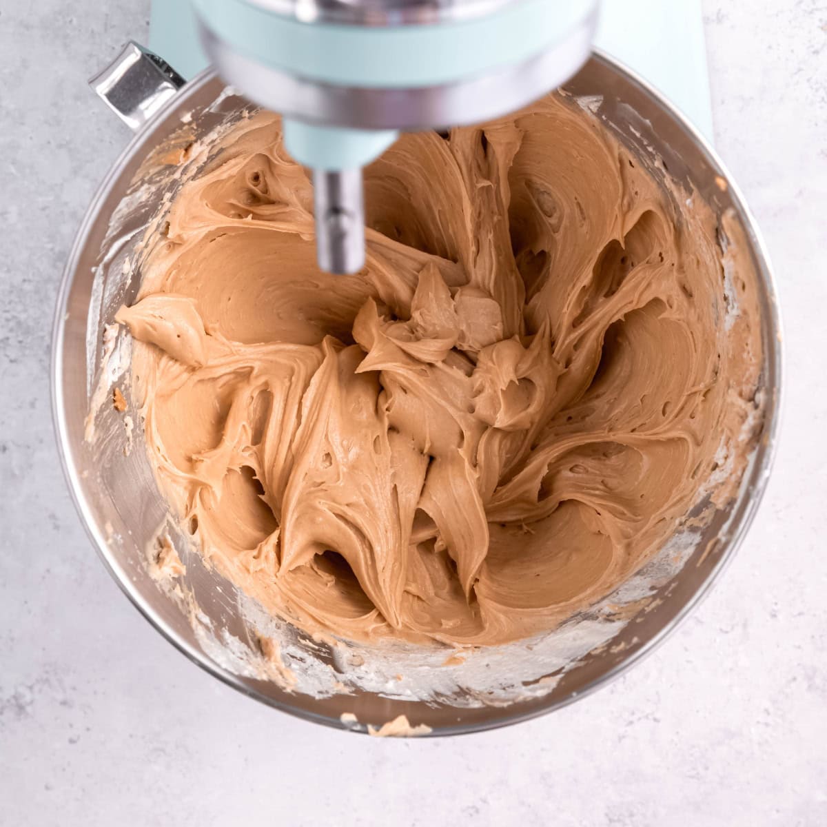 No-bake peanut butter pie filling in the bowl of a stand mixer.