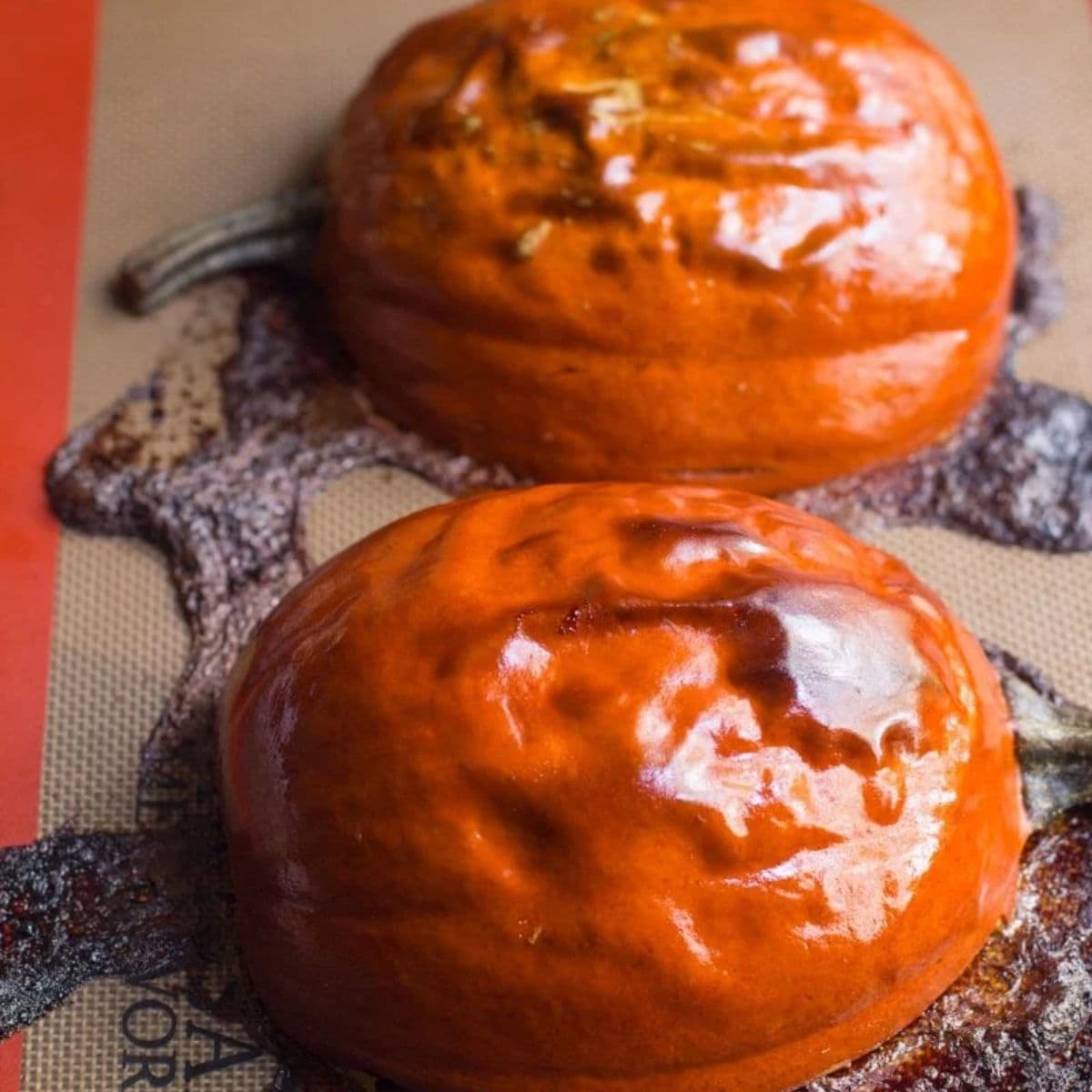 Roasted pumpkin on a silicon baking mat.