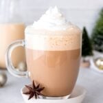 Whipped cream on top of an eggnog latte.