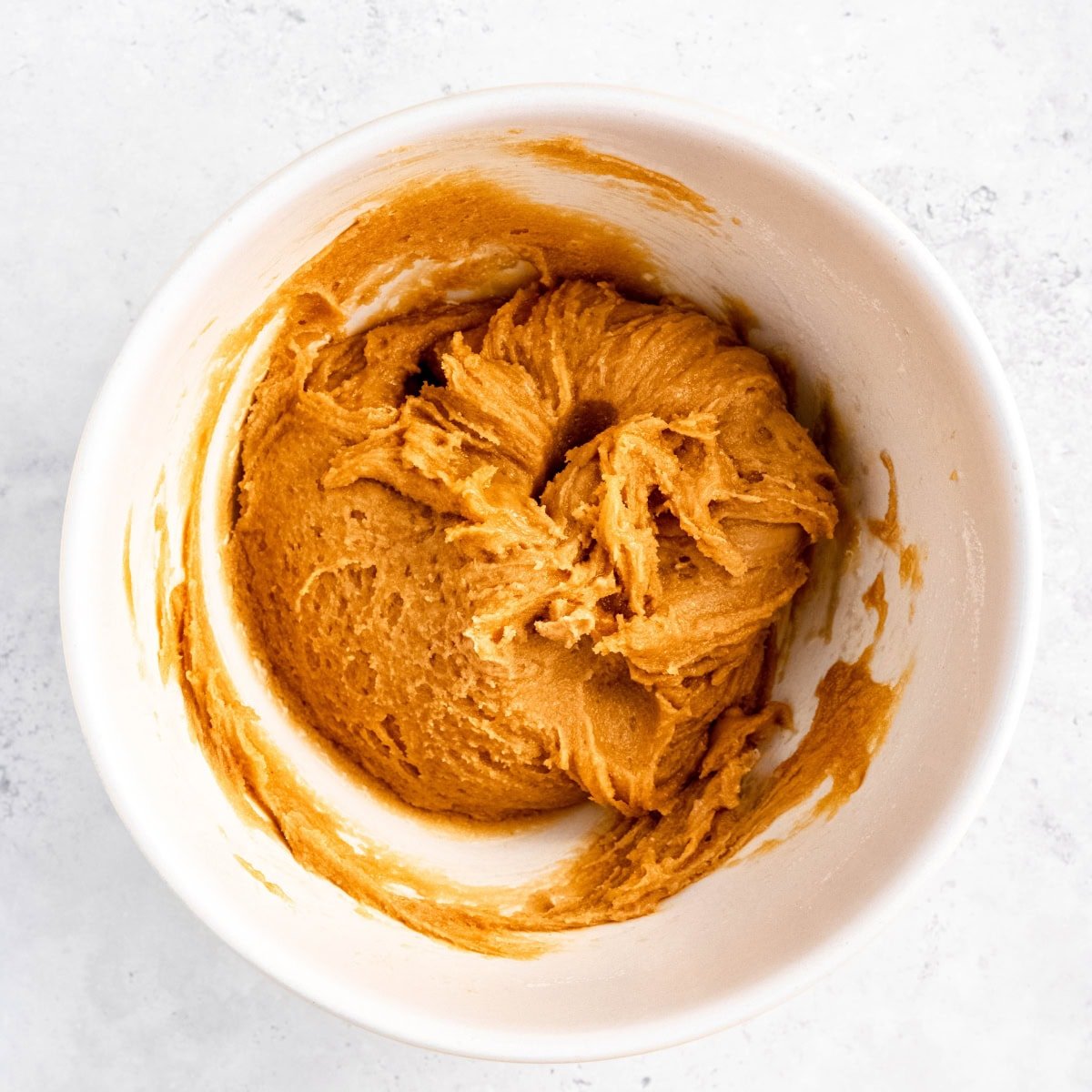 Mixed up dough for peanut butter kiss cookies.