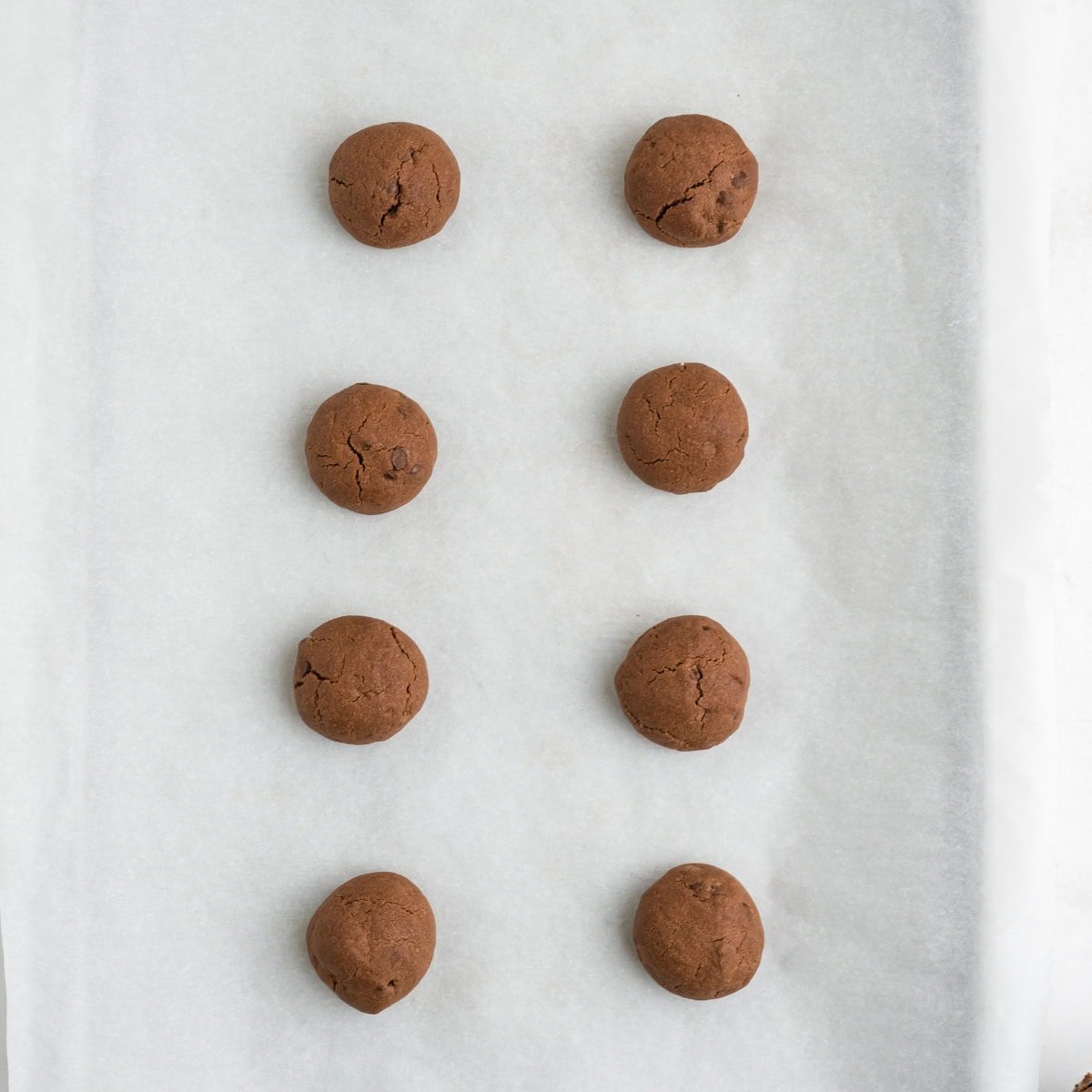 Chocolate ball cookies before rolling in powdered sugar.