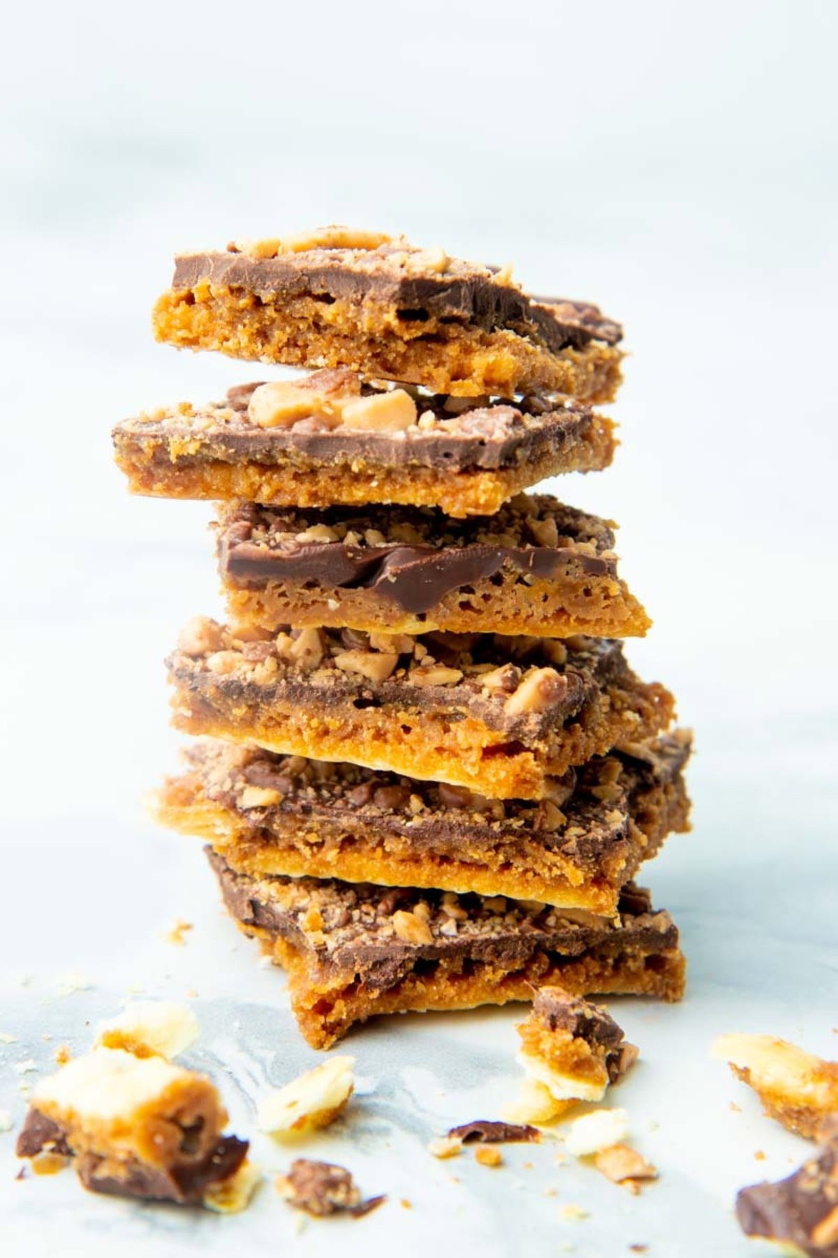 Pieces of saltine cracker toffee stacked on top of each other.
