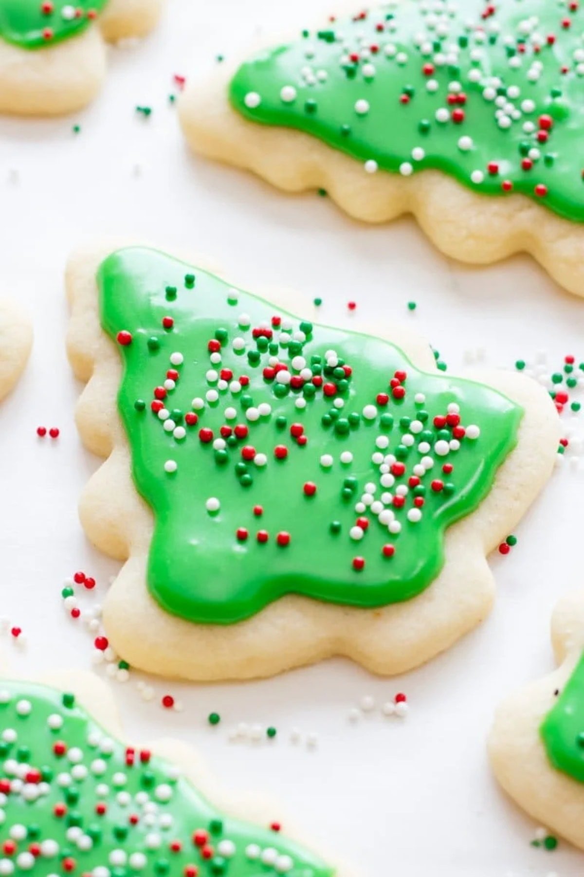 A rolled sugar cookie decorated like a Christmas tree.