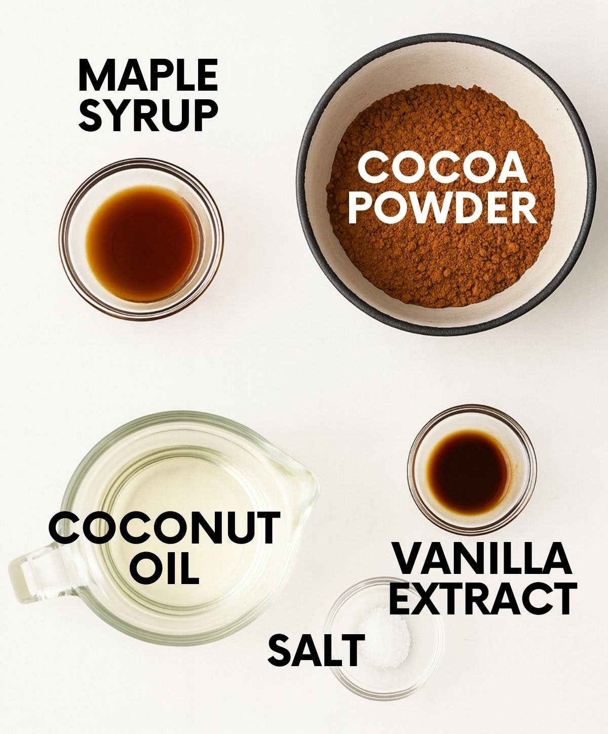 Ingredients for a vegan fudge recipe: maple syrup, cocoa powder, coconut oil, salt, vanilla.